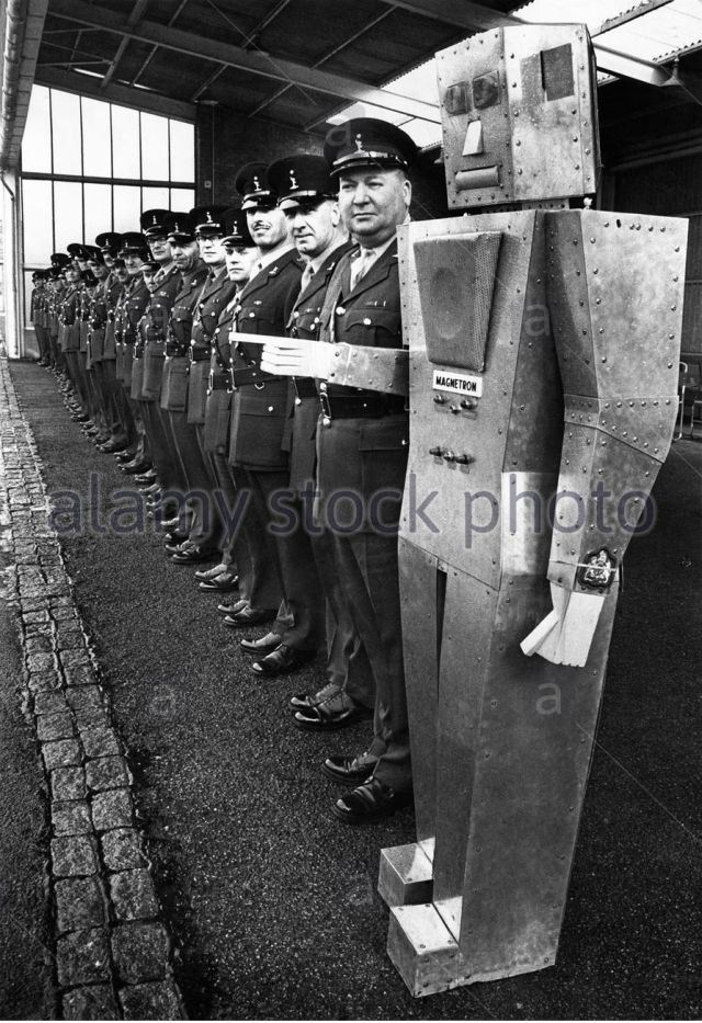 sargeant-majors-lining-up-with-robot-on-the-end-1968-x640